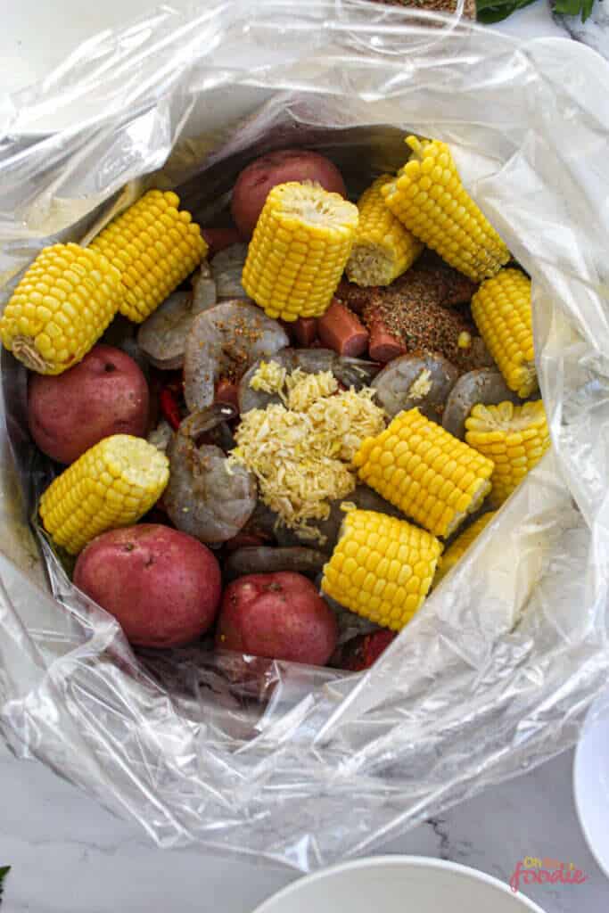 add all the seafood boil ingredients into the bag